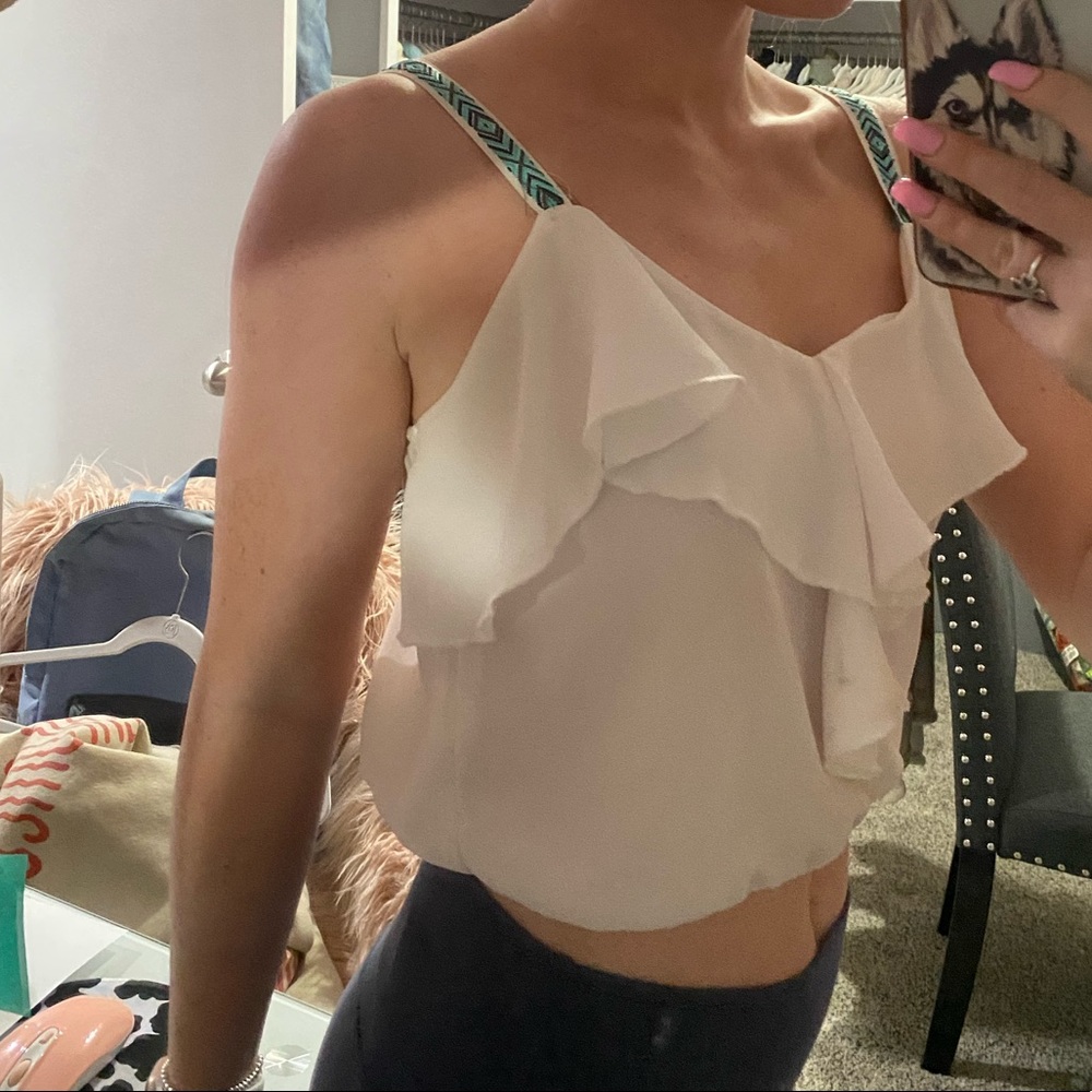 White flowy tank with turquoise and black strap